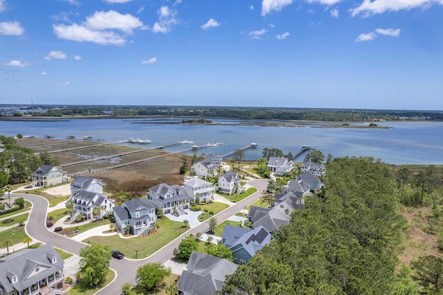 birds eye view of property featuring a water view and a residential view
