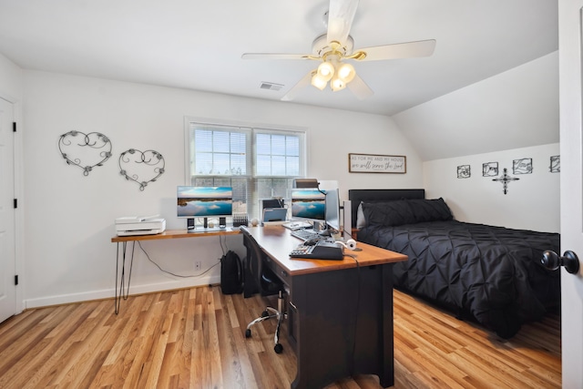 bedroom featuring vaulted ceiling, ceiling fan, and light wood-type flooring