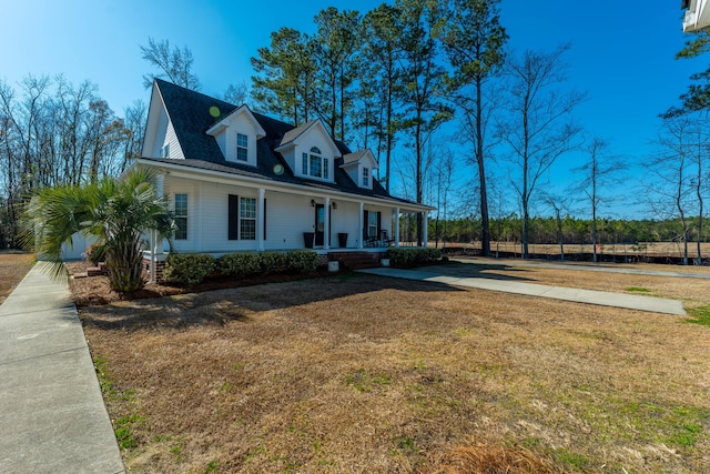view of front of property with a front yard and covered porch