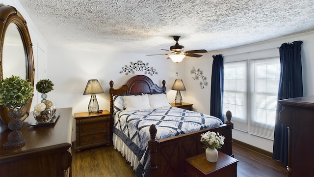 bedroom with dark hardwood / wood-style flooring, a textured ceiling, and ceiling fan