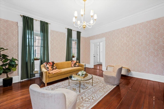 living room featuring dark wood-type flooring, ornamental molding, and a chandelier