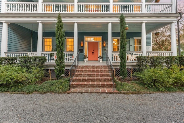 view of exterior entry with a porch