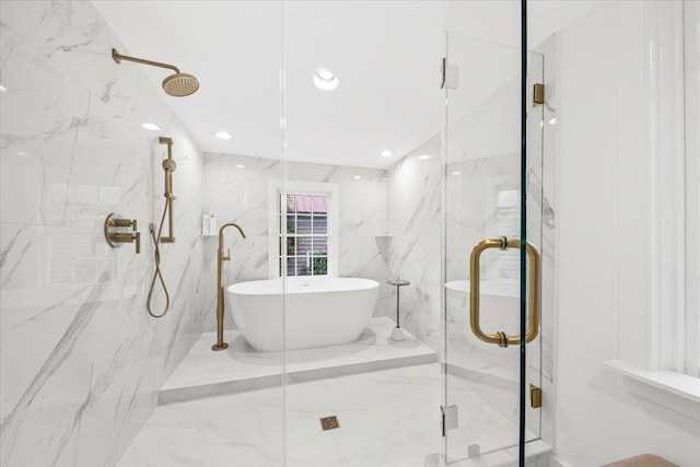 bathroom featuring tile walls and plus walk in shower