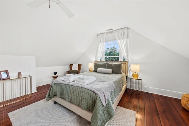 bedroom with ceiling fan, wood-type flooring, and vaulted ceiling