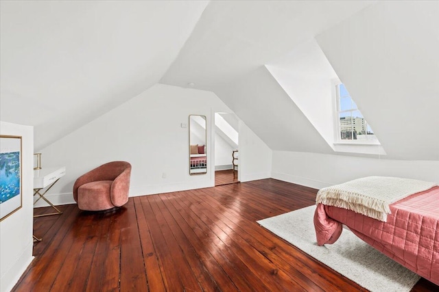 bedroom featuring vaulted ceiling and hardwood / wood-style floors