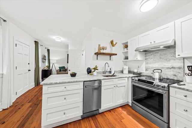 kitchen with white cabinetry, stainless steel appliances, and sink