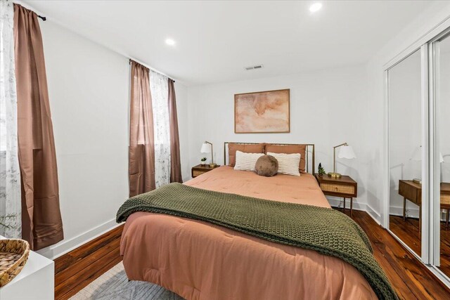 bedroom featuring hardwood / wood-style flooring and a closet