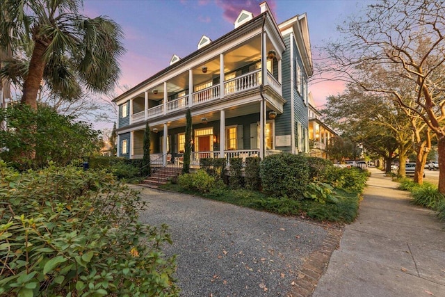 view of front of home featuring a balcony