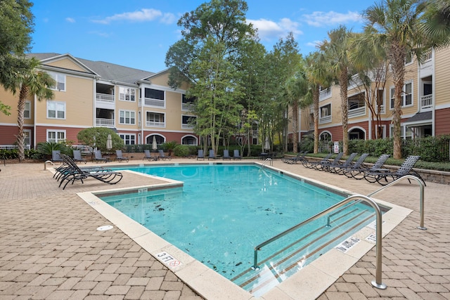 view of swimming pool with a patio area