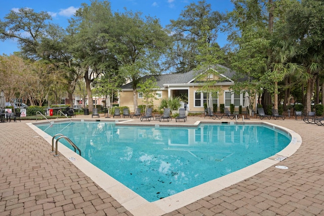 view of swimming pool featuring a patio