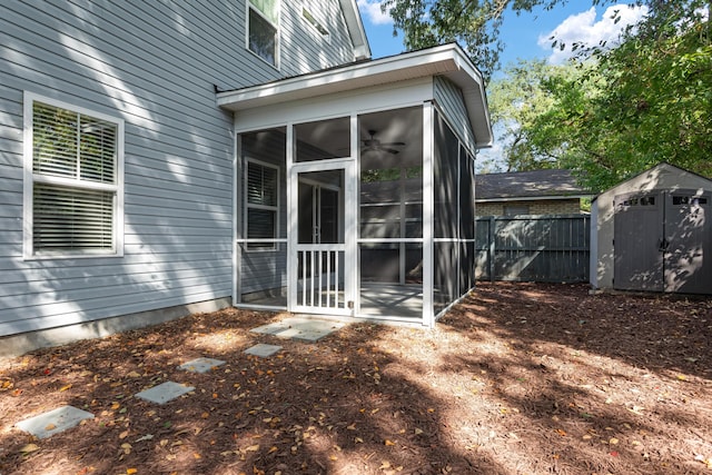 back of property with a sunroom