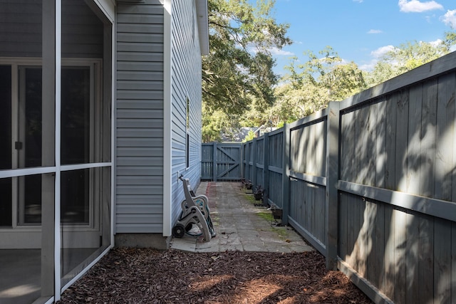 view of property exterior with a patio area