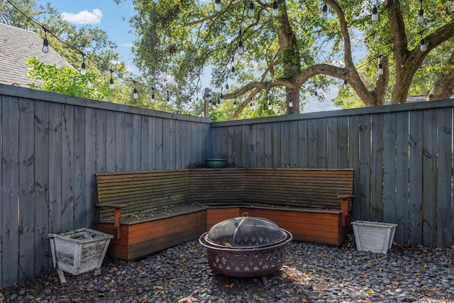 view of patio with an outdoor fire pit