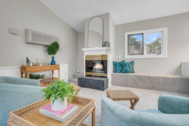 carpeted living room featuring vaulted ceiling and a wall mounted AC