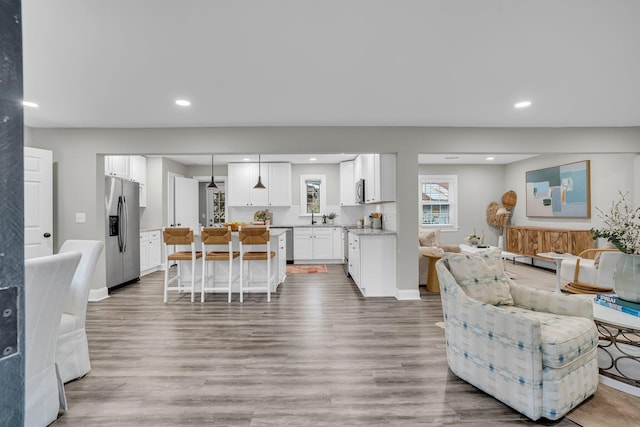 living room with light hardwood / wood-style flooring