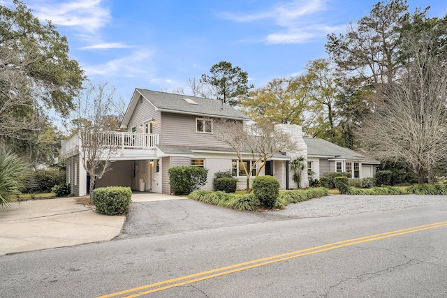 view of front property featuring a carport