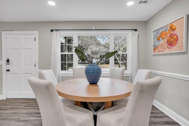 dining area with wood-type flooring