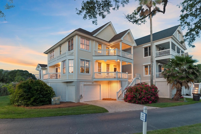 1647 Marsh Harbor Ln, Mount Pleasant, SC 29464 - view of front of property with a balcony, a garage, asphalt driveway, and stairway