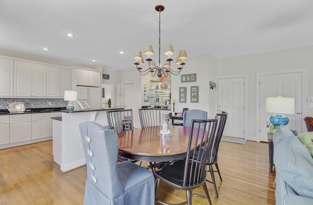 1647 Marsh Harbor Ln, Mount Pleasant, SC 29464 - dining area with a chandelier, light wood-style floors, crown molding, and recessed lighting