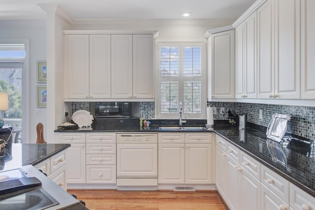 1647 Marsh Harbor Ln, Mount Pleasant, SC 29464 - kitchen featuring white dishwasher, a sink, black microwave, crown molding, and backsplash