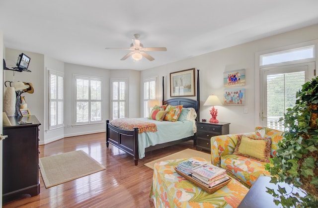 1647 Marsh Harbor Ln, Mount Pleasant, SC 29464 - bedroom featuring multiple windows, wood finished floors, ceiling fan, and baseboards