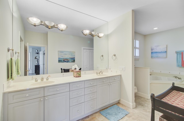 1647 Marsh Harbor Ln, Mount Pleasant, SC 29464 - bathroom featuring double vanity, a garden tub, and toilet