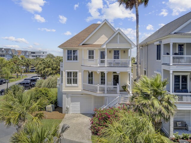 1647 Marsh Harbor Ln, Mount Pleasant, SC 29464 - beach home featuring stairway, covered porch, a balcony, a garage, and concrete driveway