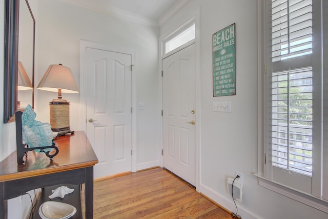1647 Marsh Harbor Ln, Mount Pleasant, SC 29464 - foyer with ornamental molding, plenty of natural light, light wood-type flooring, and baseboards