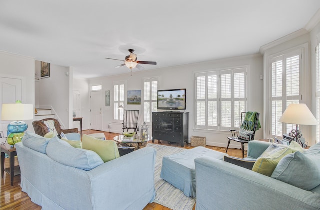 1647 Marsh Harbor Ln, Mount Pleasant, SC 29464 - living room featuring healthy amount of natural light, ceiling fan, wood finished floors, baseboards, and ornamental molding