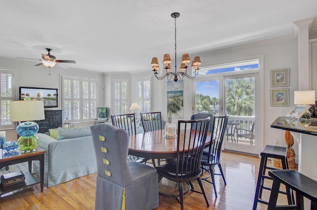 1647 Marsh Harbor Ln, Mount Pleasant, SC 29464 - dining area featuring ornamental molding, a chandelier, light wood finished floors, and a ceiling fan