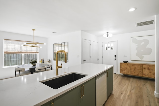 1366 W Point Dr, Mount Pleasant, SC 29466 - kitchen with a chandelier, a sink, green cabinets, stainless steel dishwasher, and recessed lighting