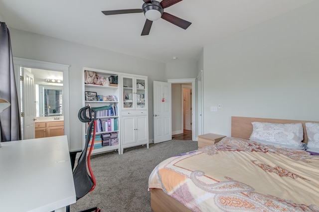 carpeted bedroom featuring ceiling fan and ensuite bathroom