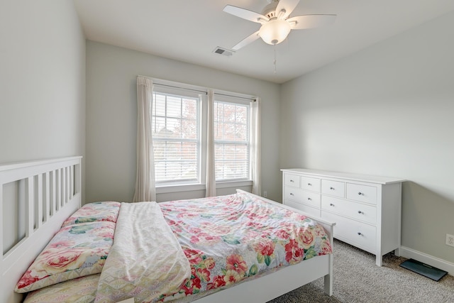 bedroom featuring ceiling fan and light colored carpet