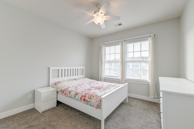 bedroom featuring ceiling fan and light carpet