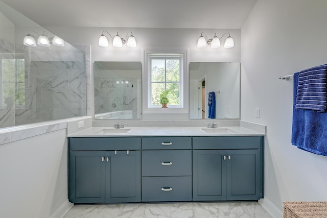 bathroom featuring marble finish flooring, double vanity, a marble finish shower, and baseboards