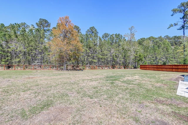view of yard with a forest view