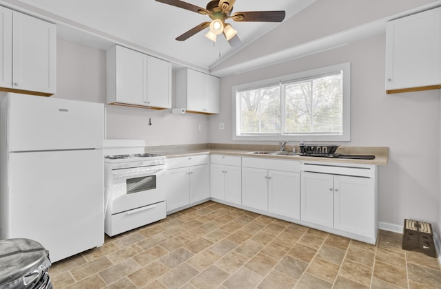 kitchen with lofted ceiling, sink, white appliances, ceiling fan, and white cabinetry