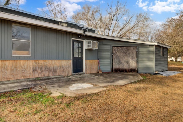 exterior space with a patio and a lawn