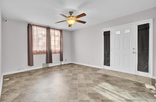 spare room with ceiling fan