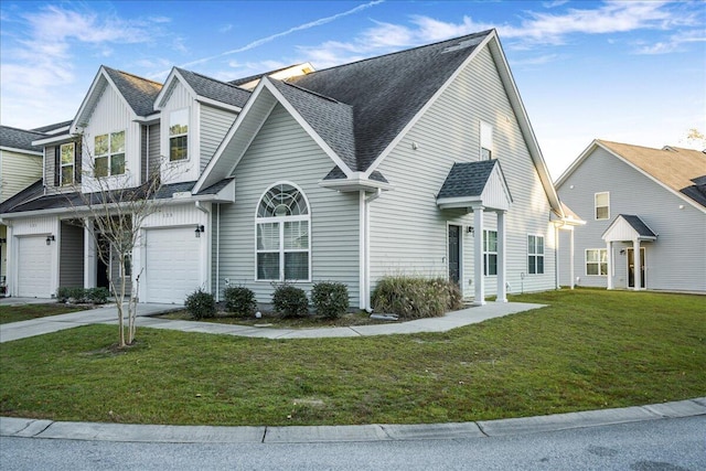 view of front facade featuring a front yard and a garage