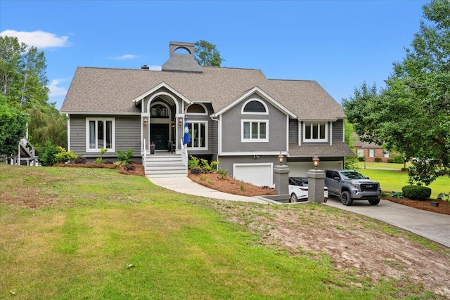 view of front of house featuring concrete driveway, an attached garage, a front yard, and a shingled roof