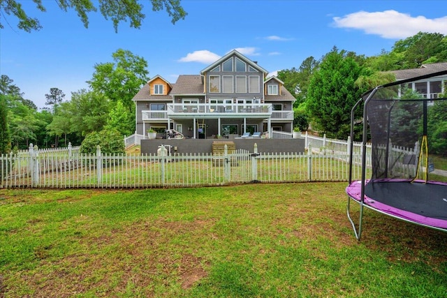 back of house featuring a trampoline