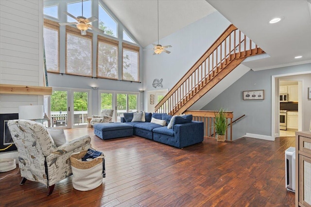living area featuring a ceiling fan, plenty of natural light, hardwood / wood-style floors, high vaulted ceiling, and recessed lighting