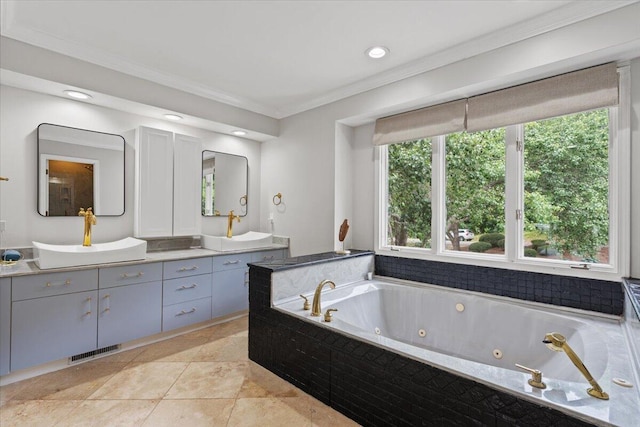 full bathroom with crown molding, a tub with jets, double vanity, and recessed lighting