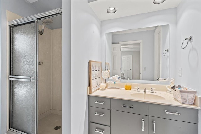 full bathroom featuring a shower stall and vanity