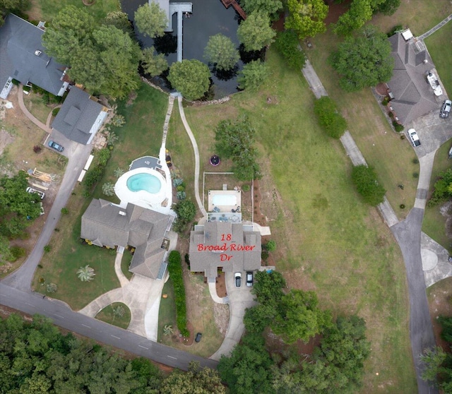aerial view of property's location featuring a pool area