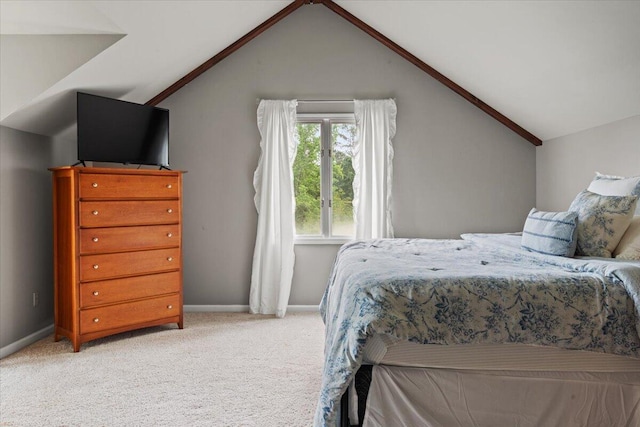 bedroom featuring vaulted ceiling, carpet floors, and baseboards