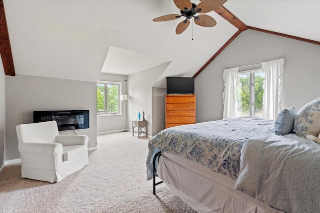 bedroom with lofted ceiling, carpet floors, baseboards, and ceiling fan