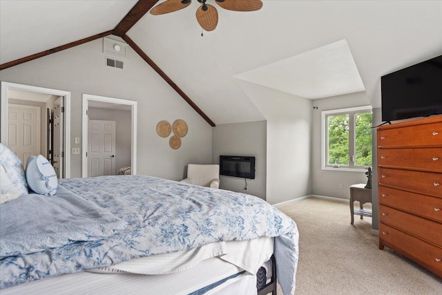 bedroom featuring vaulted ceiling, light carpet, ceiling fan, and baseboards