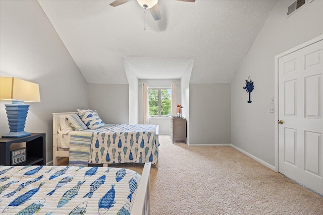 bedroom featuring vaulted ceiling, carpet floors, ceiling fan, baseboards, and a textured ceiling